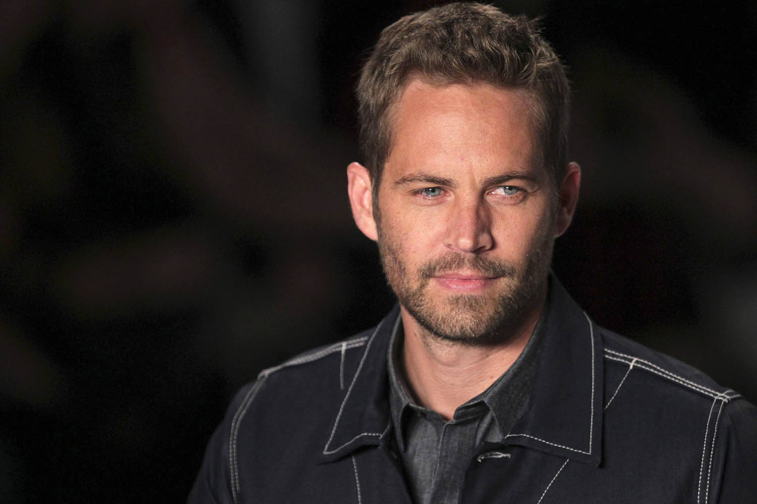 U.S. actor Paul Walker presents a creation during Sao Paulo Fashion Week in this file photo taken March 21, 2013. Walker, best known for his roles in the Fast and the Furious action movies, died on Saturday in a car crash in Southern California, his publicist said.  REUTERS/Filipe Carvalho/Files  (BRAZIL - Tags: OBITUARY ENTERTAINMENT)