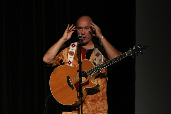 Grammy award-winning artist Jack Gladstone performs in auditorium