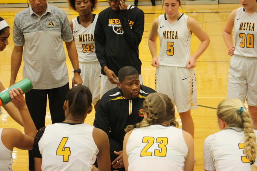 The Mustangs were in a timeout during first quarter discussing order of play against opposing team Plainfield South high school.
