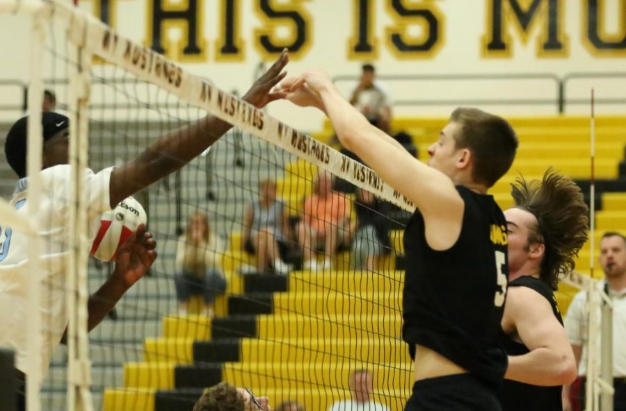 On April 22nd, the boys played against Willowbrook High School. In the second set, outside hitter Ryan Owens blocks the ball.