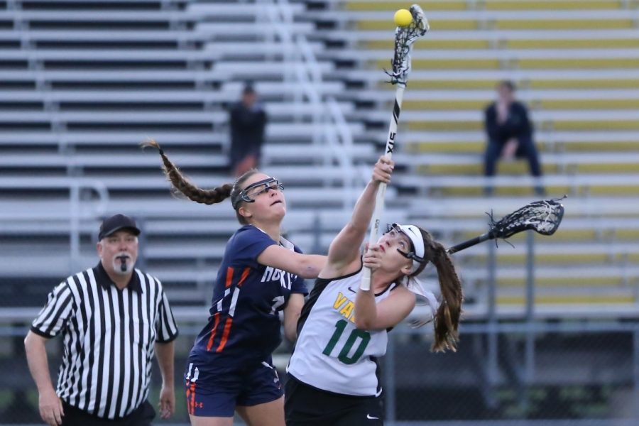 No. 10 Caitlin Beacom faceoff the opposing team Naperville North on April 24th.
