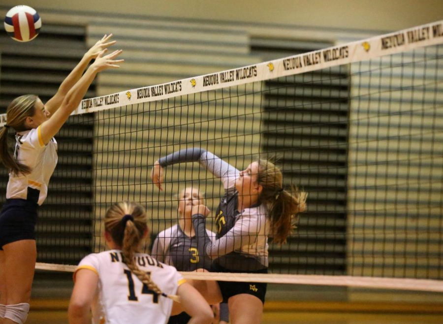 No. 15, middle hitter, Keira Jannisch, goes for the kill during the first set. 