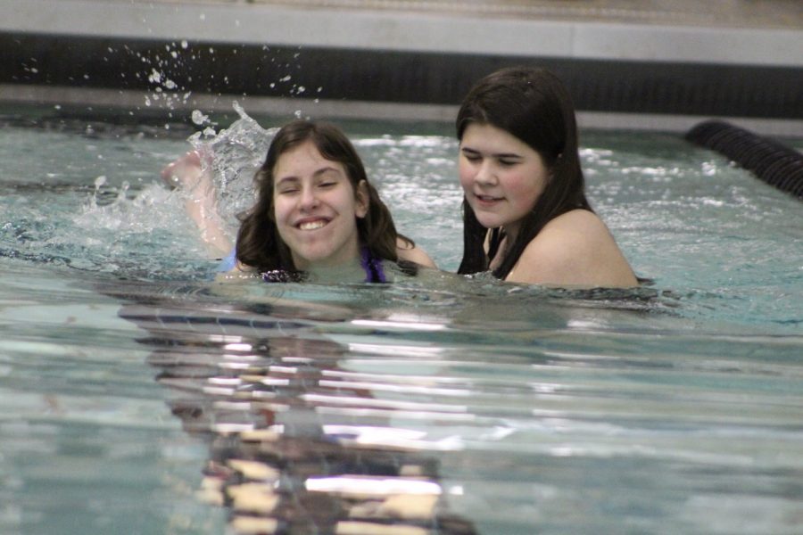 Senior Kirsten Dullnigg and Emma Gatz participate in assisted swim.