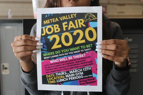 Posters advertising the job fair hope to attract interested students.