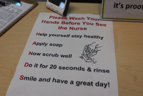 Signs have been put up around the school to prevent the spread of sickness.