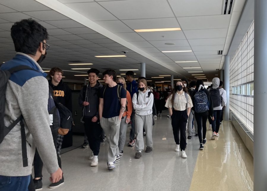 Students are seen walking to class during passing period just days after Illinois mask guidelines became optional.