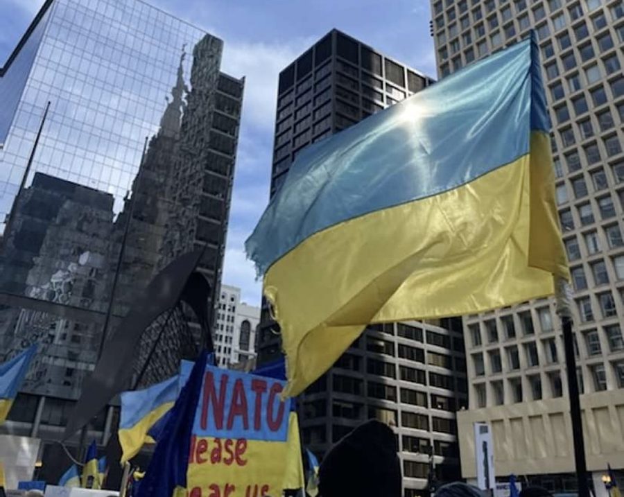 People wave the Ukrainian flag during a protest in Chicago.