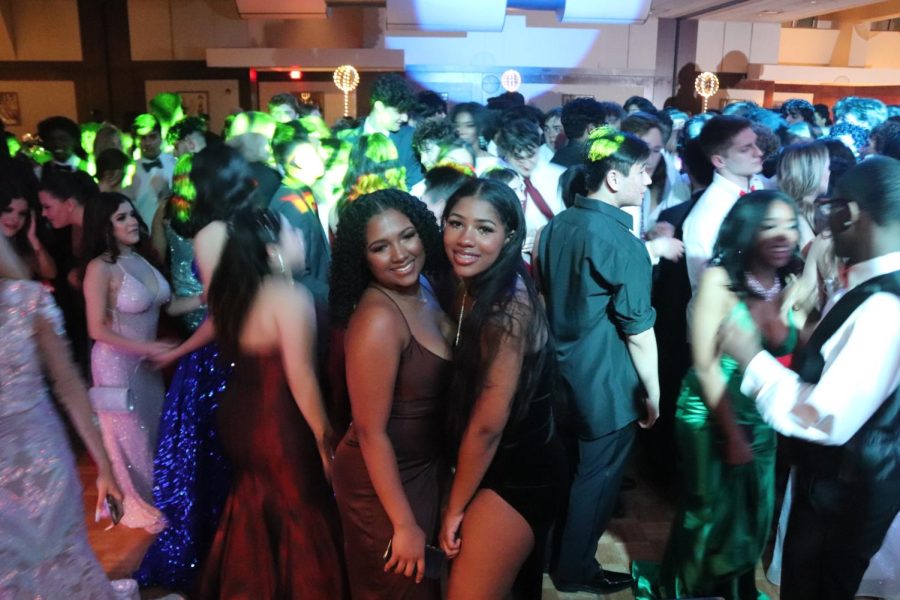 Juniors pose for a photo on the dance floor. 