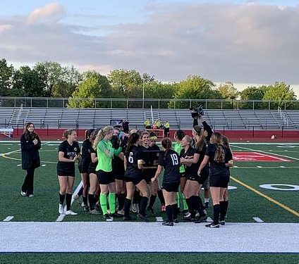 Jordan Lange taking it all in and celebrating with her team after scoring the goal to clinch Metea’s first sectional championship in girls’ soccer