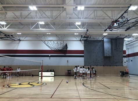 The sophomore volleyball team huddle up for a team discussion after their last match at the Batavia Quad Tournament last week. 