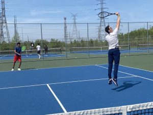 Members of the boys tennis team practice as their season wraps up.