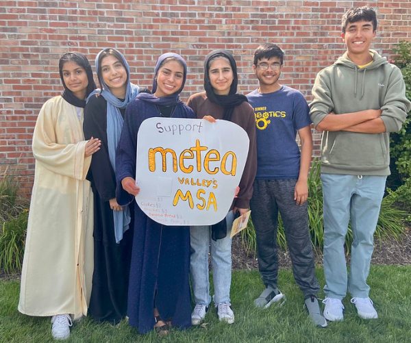 Members of the Muslim Student Association board celebrate their club together.