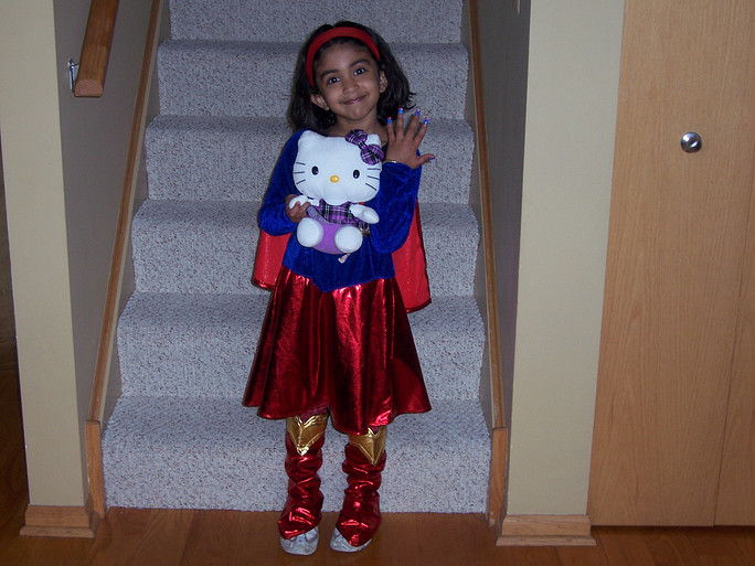 Ritika Khurana poses for the camera in a cherished Supergirl costume at the age of five.