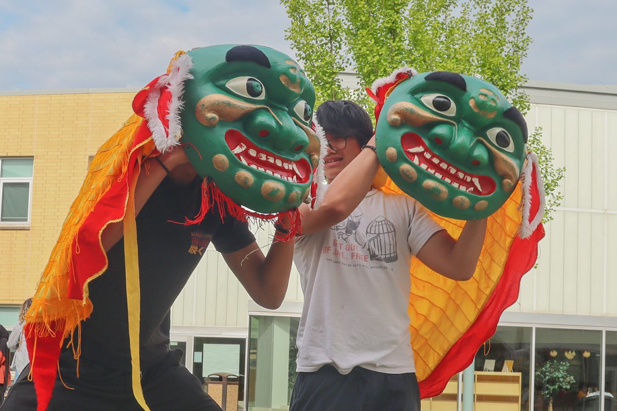 Masks for lion-dancing, built to scare away evil spirits, are displayed for people to view and try on.