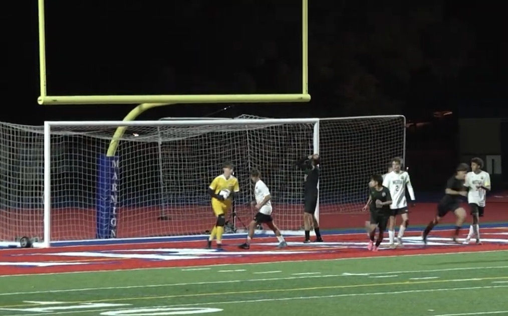 Senior goalkeeper Patrick Maroney saves a shot attempt from the Wildcats in the first half.