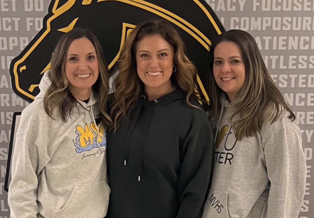 RAD teachers, Jenny Oas, Ashley Abruscato, Meghan Flannagan, pose next to the Auxilary gym