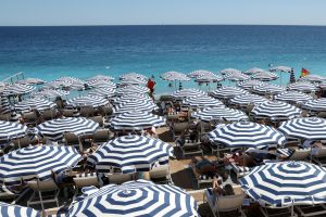 A view shows a beach with deckchairs and parasols on a sunny summer day on the Promenade des Anglais in Nice, France, July 8, 2025. REUTERS/Kevin Coombs