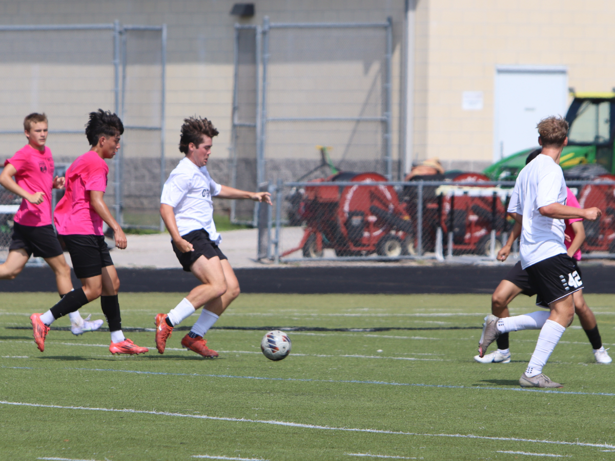 Geneva player attempts to pass the ball to teammate.