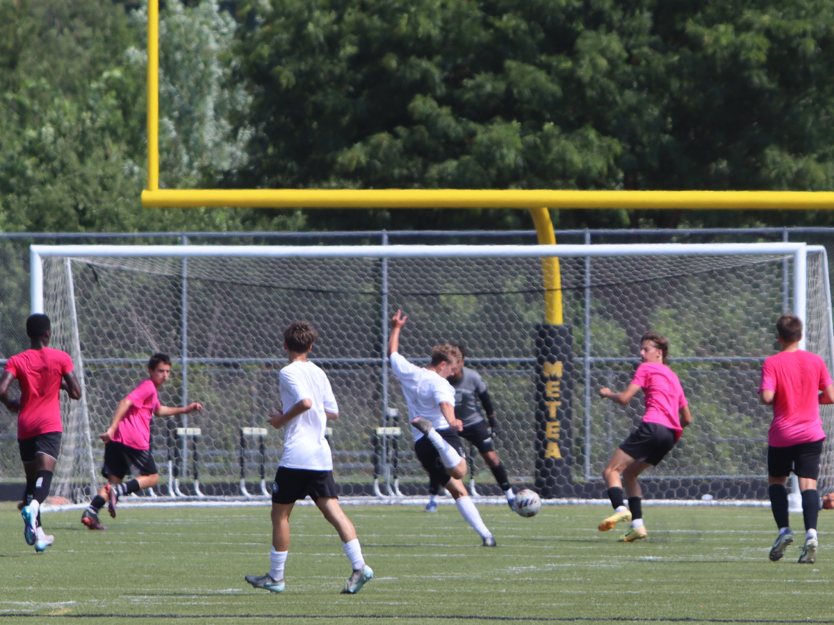 Geneva player takes shot on the Metea goalie.