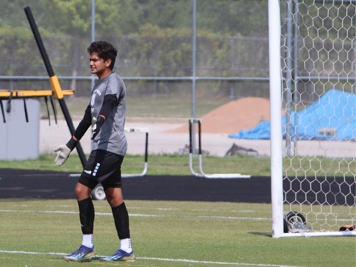Metea goalie communicates to teammates during the scrimmage.