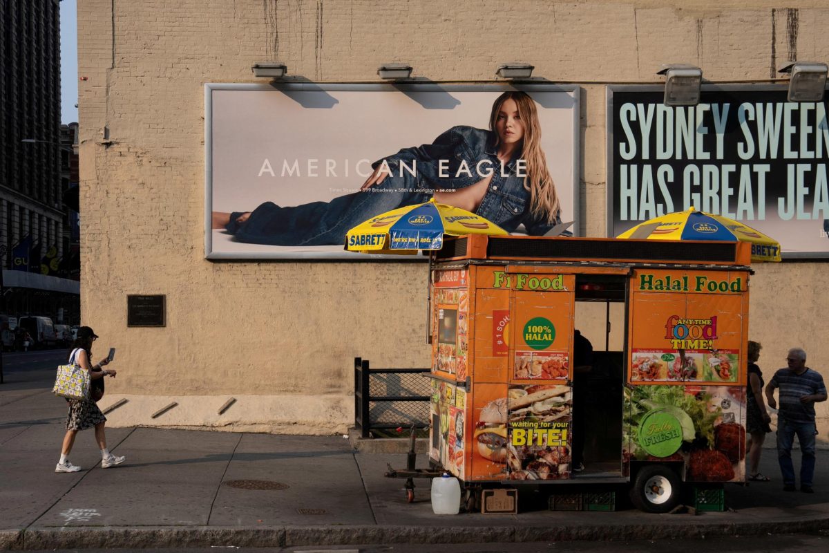 A woman walks near an American Eagle ad campaign featuring Sydney Sweeney in New York City, U.S., August 4, 2025. REUTERS/David 'Dee' Delgado