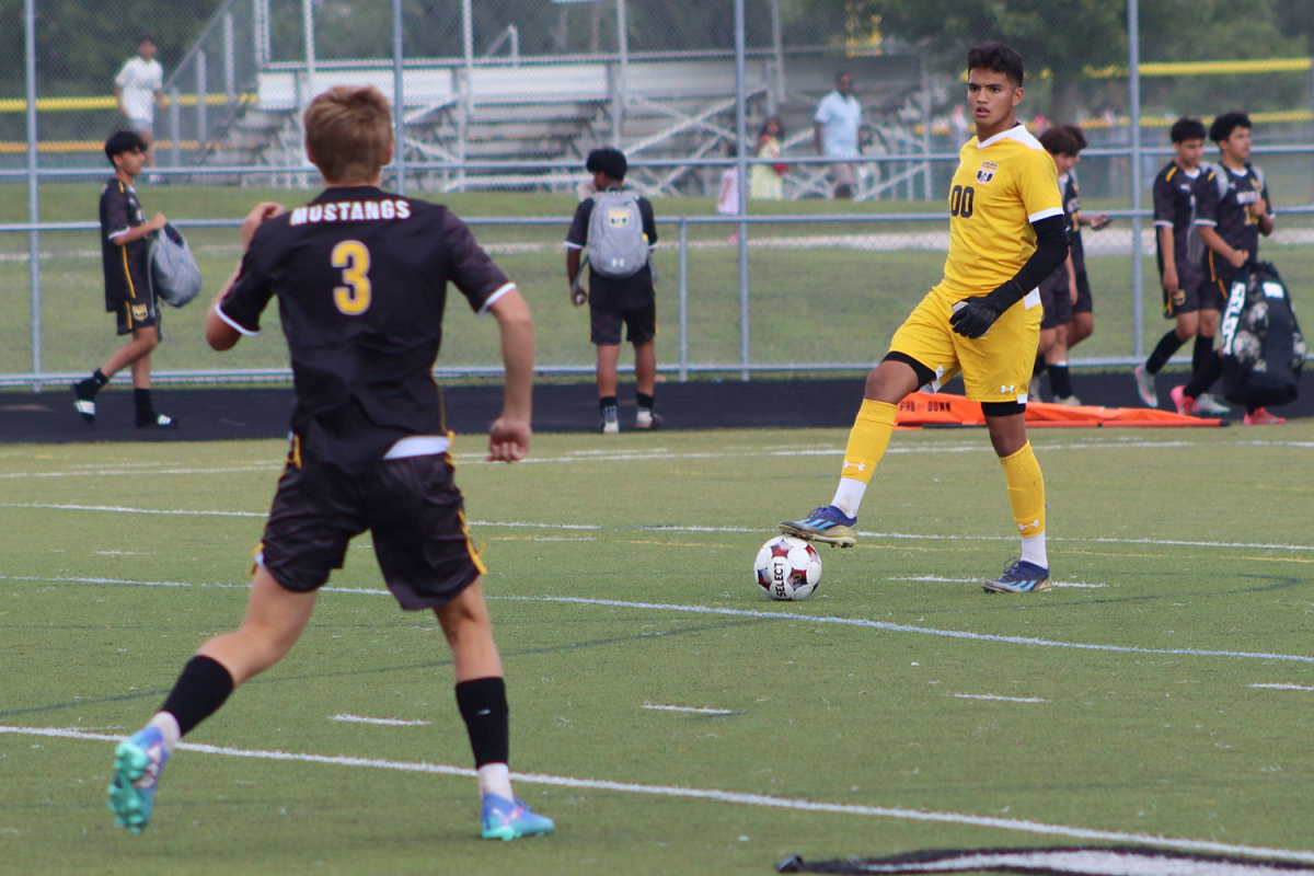 Goalkeeper Nathan Macilla passes the ball to defense player Everett Kot