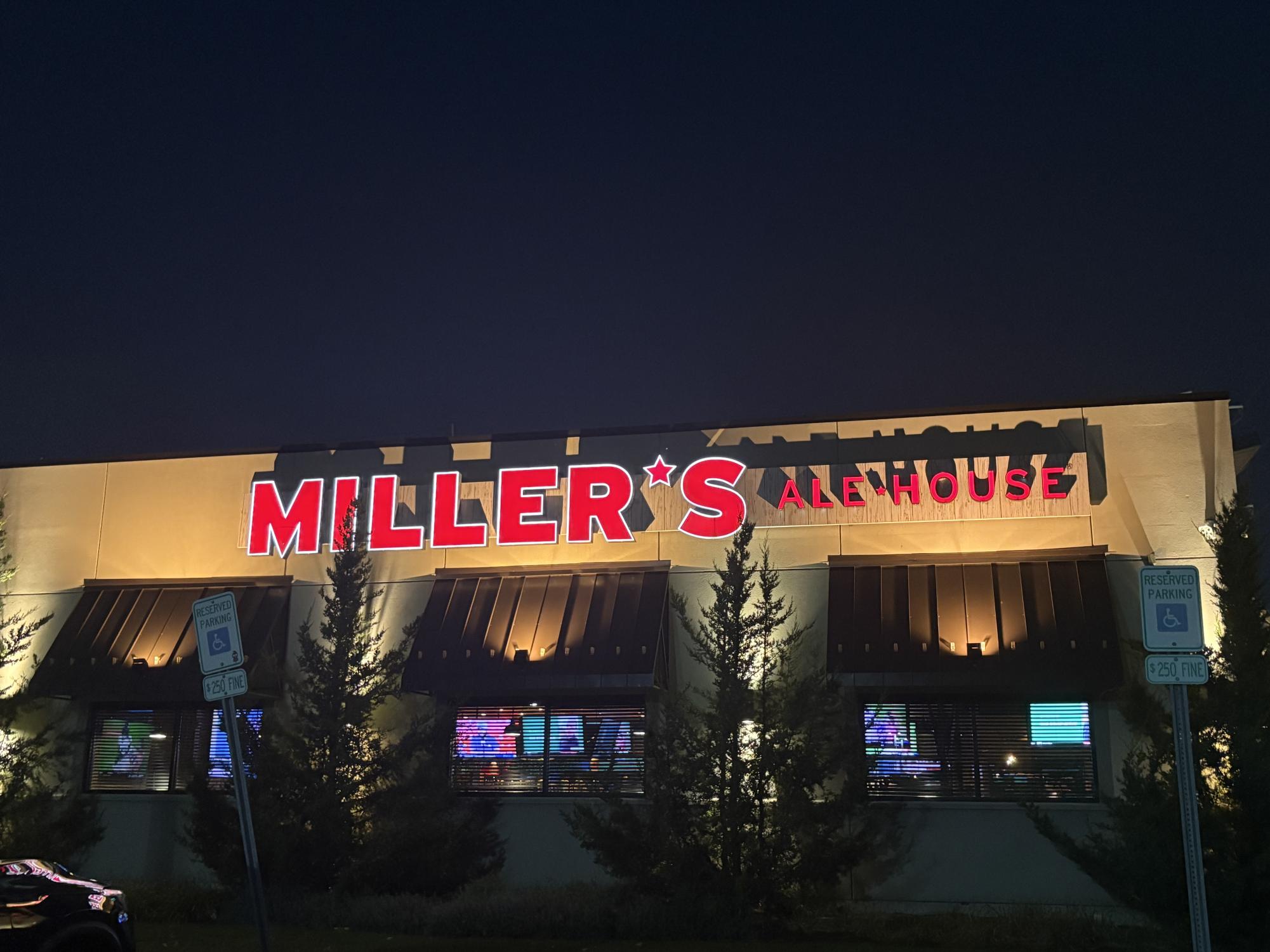 Millers sign lights up the night sky.