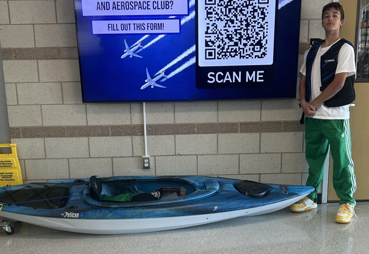 Junior Corbin Lobos brings a kayak to showcase his creativity for spirit day.
