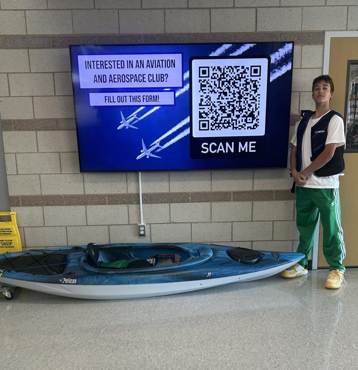 Junior Corbin Lobos brings a kayak to showcase his creativity for spirit day.