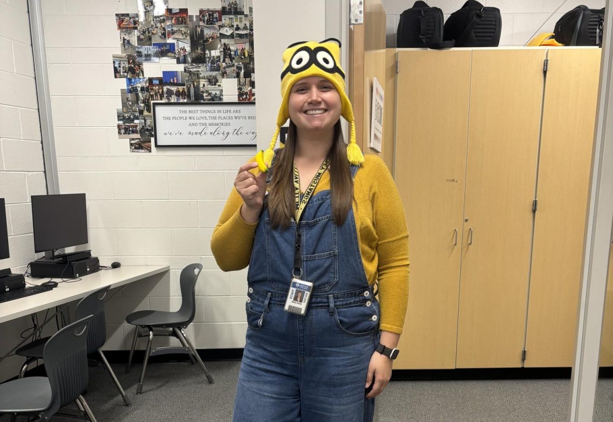 Media teacher Molly Quinn dresses up as a yellow minion to show her spirit before homecoming weekend.