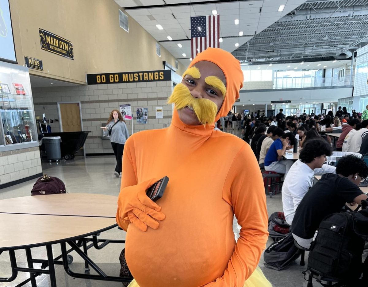 Sophomore Bhuvi Gopi twins with a friend as the Lorax to celebrate the homecoming spirit week.