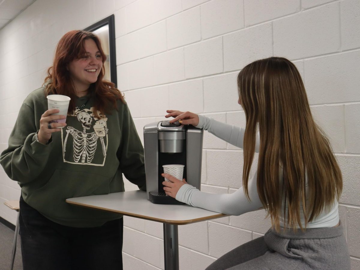 Mia and Rayma share a coffee during school hours