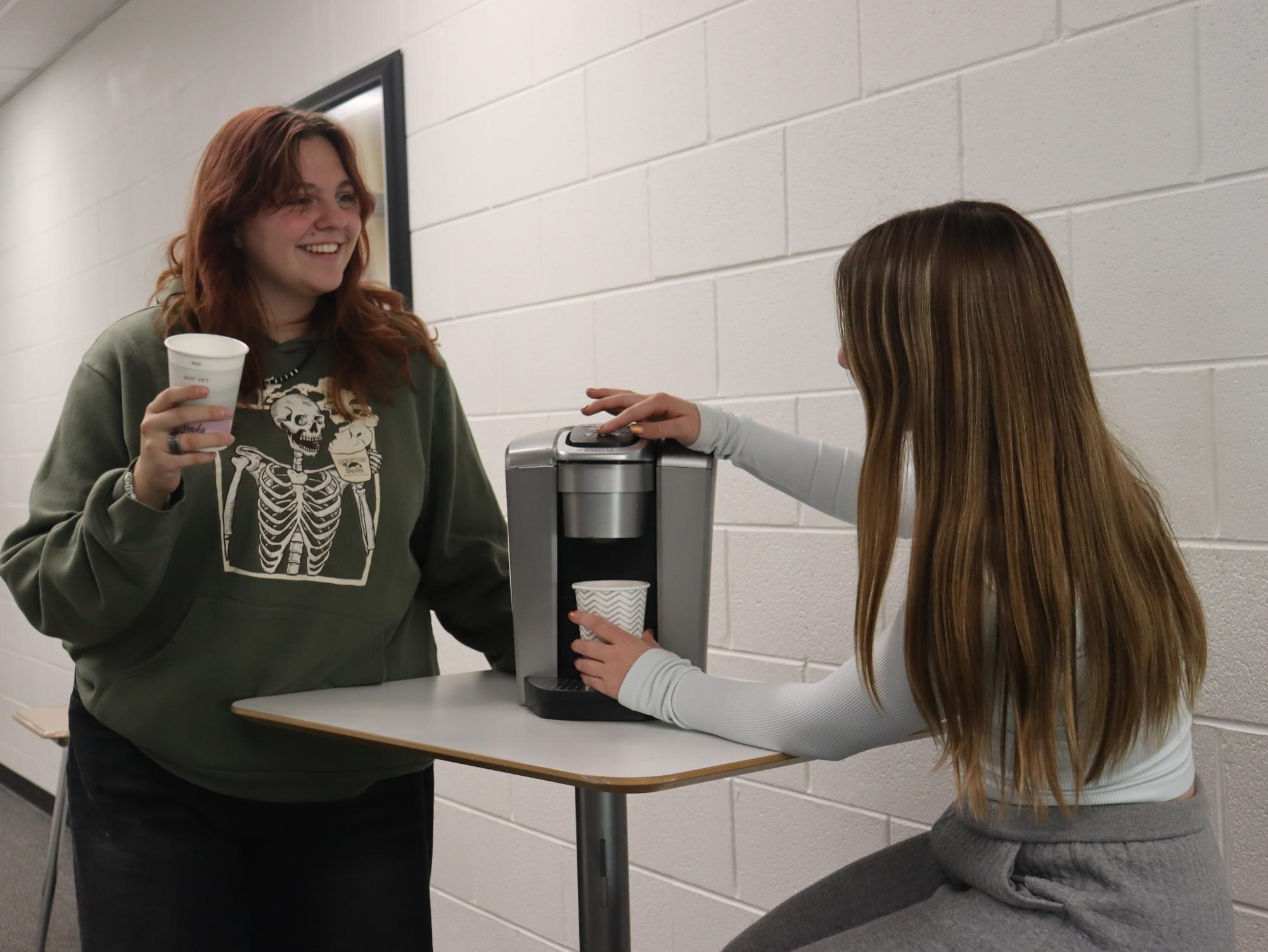 Mia and Rayma share a coffee during school hours