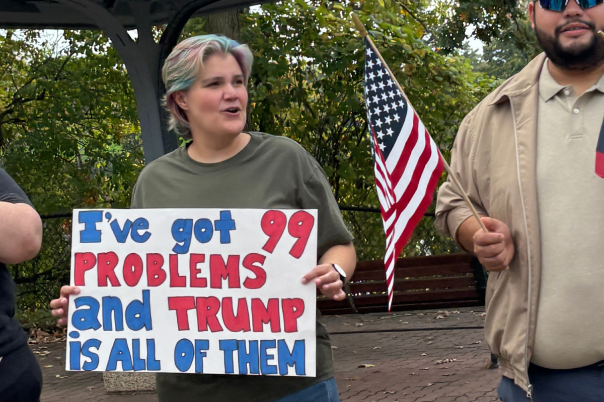 Protester holds up sign during the No Kings movement.