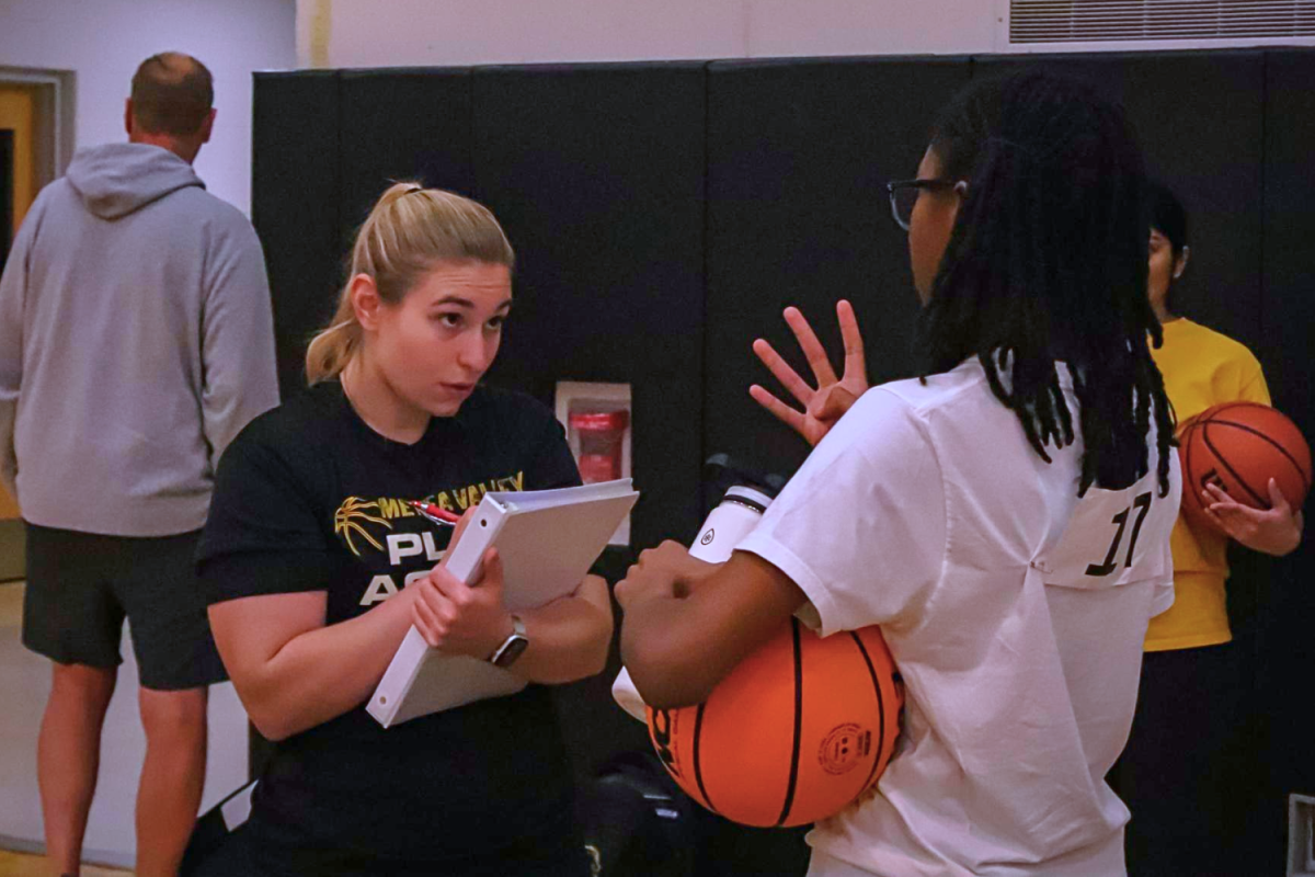 Coach Lavelle shows interest in player during tryouts.