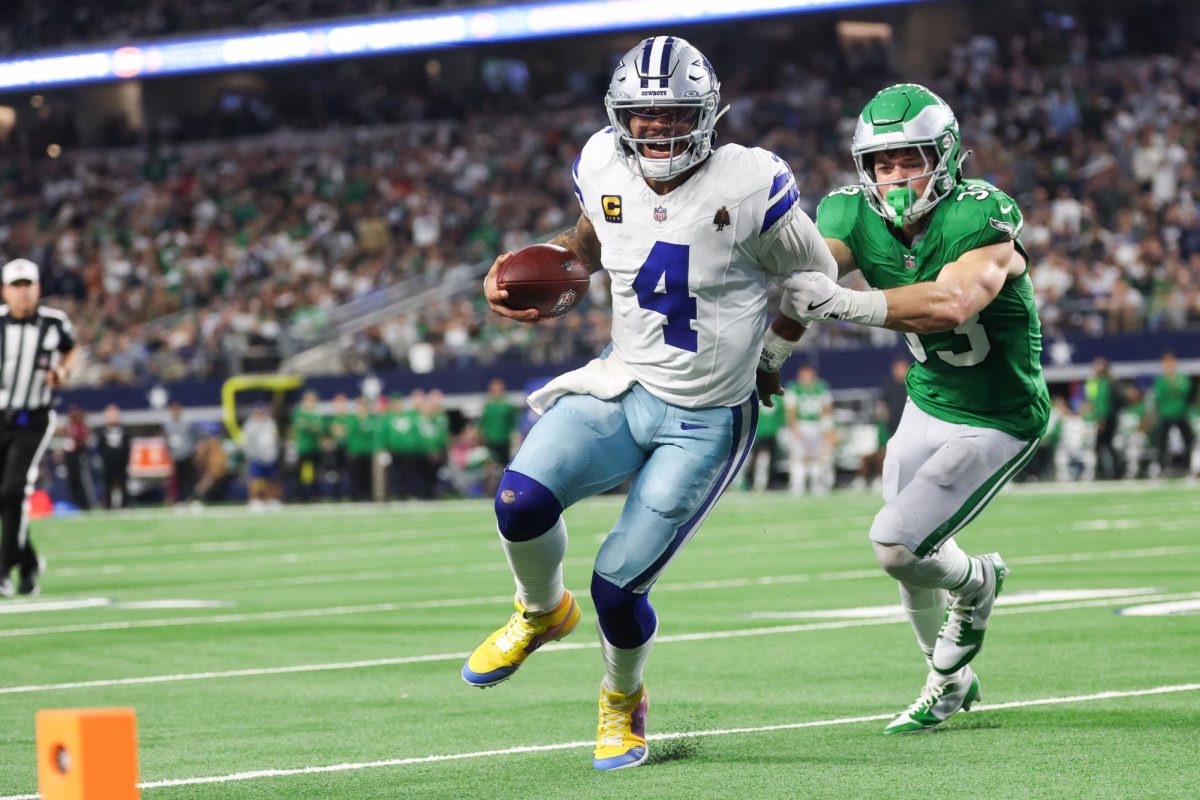 Nov 23, 2025; Arlington, Texas, USA; Dallas Cowboys quarterback Dak Prescott (4) runs with the ball in attempt to score a touchdown in the fourth quarter against the Philadelphia Eagles at AT&T Stadium. Mandatory Credit: Kevin Jairaj-Imagn Images