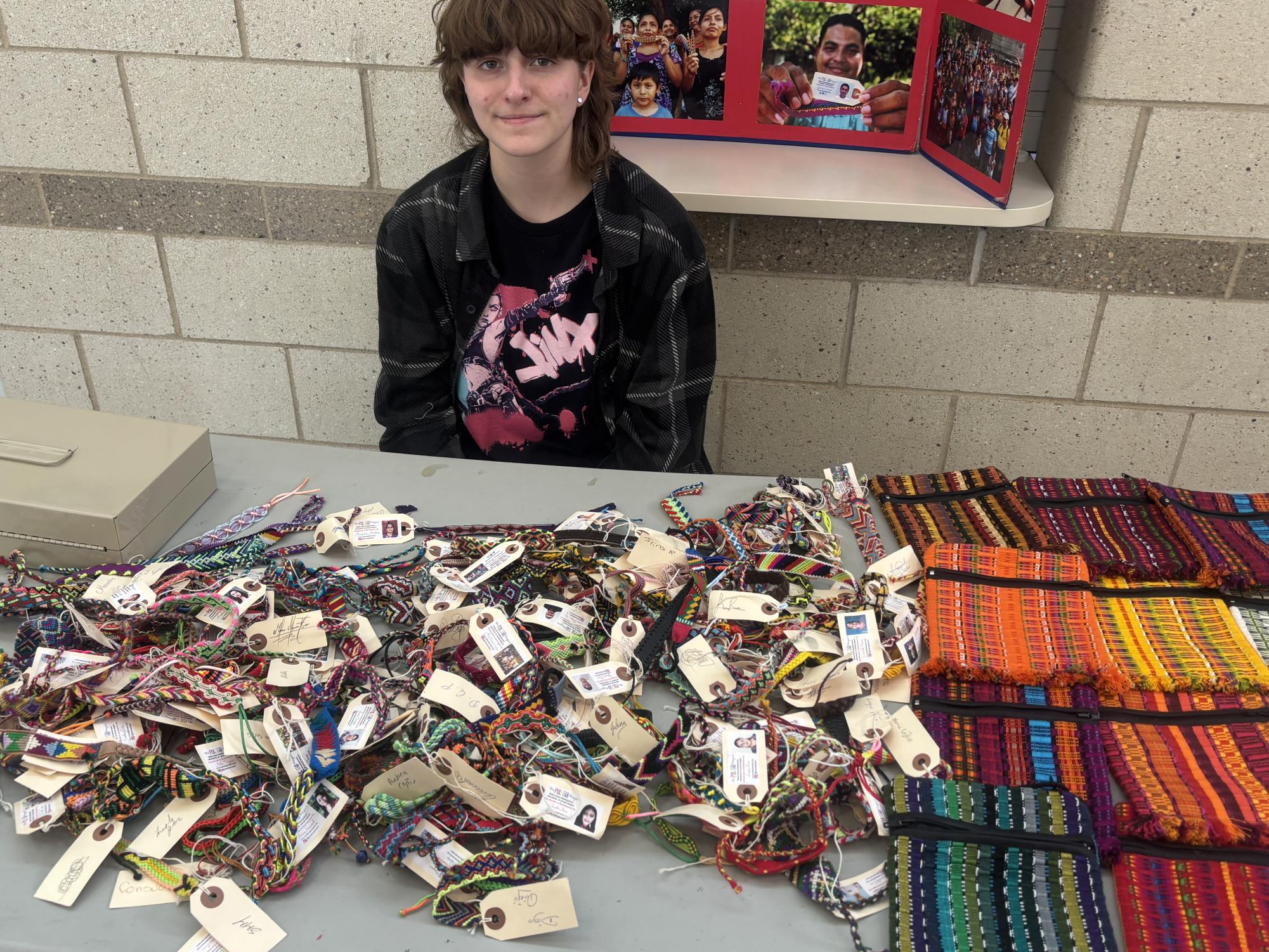 Senior Gray Parli is seen selling handmade pulseras and bolsitas from Nicaragua. Helping to raise funds for essential programs and central America.