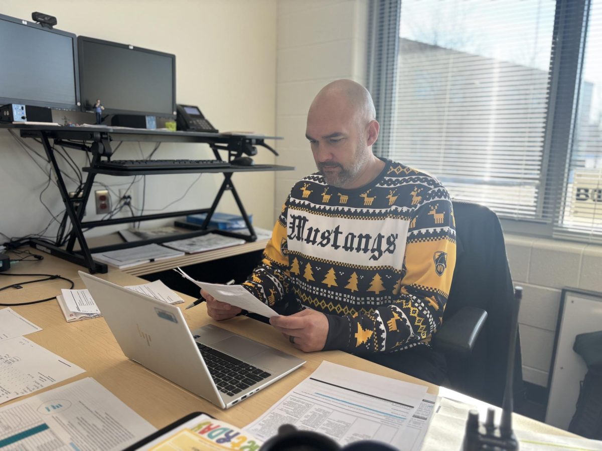 Dan Debryucker works hard as he finishes his second to last semester working as the principal for Metea Valley.
