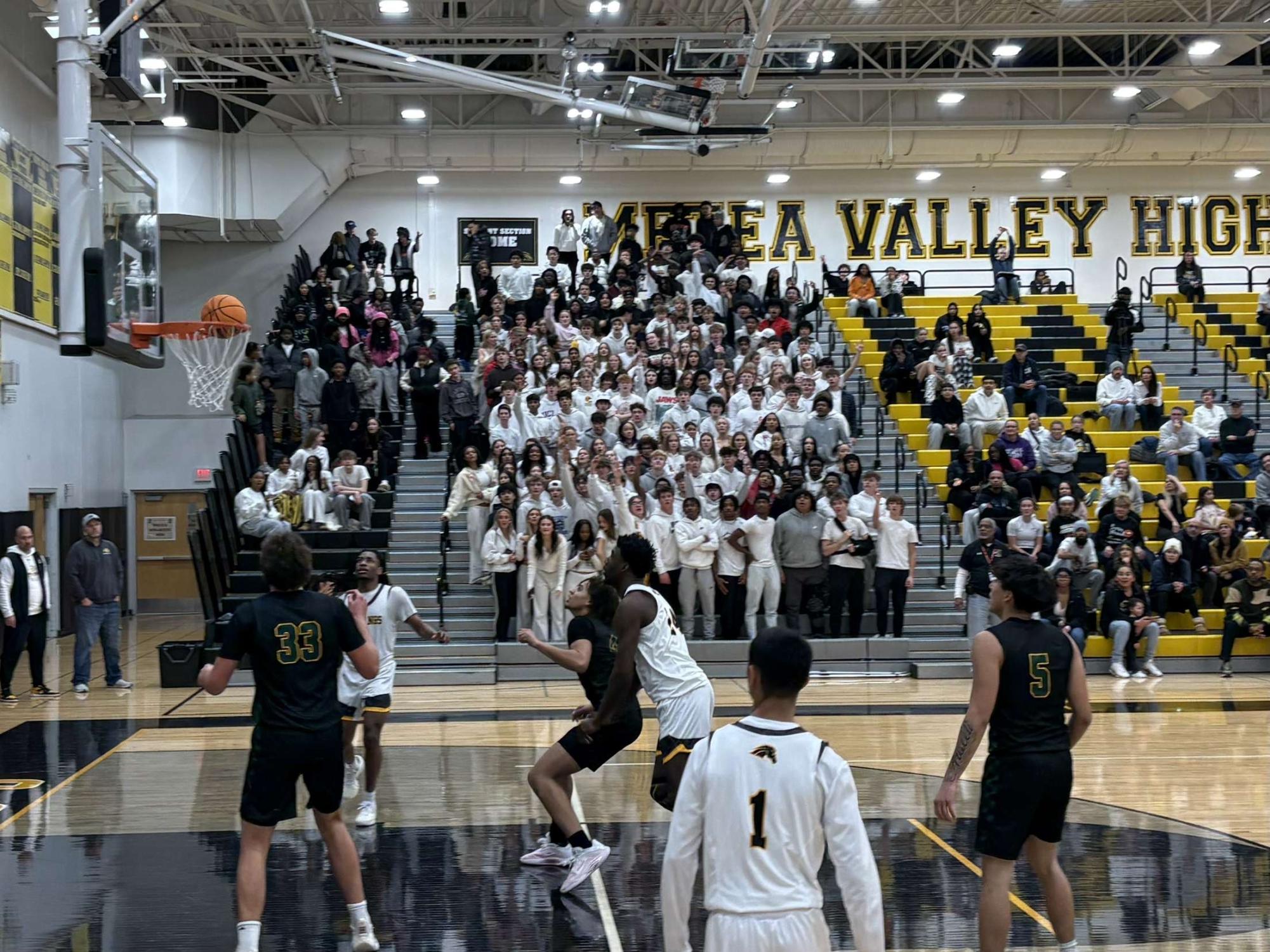 Senior Tre Watkins sinks a deep three on the third quarter buzzer.