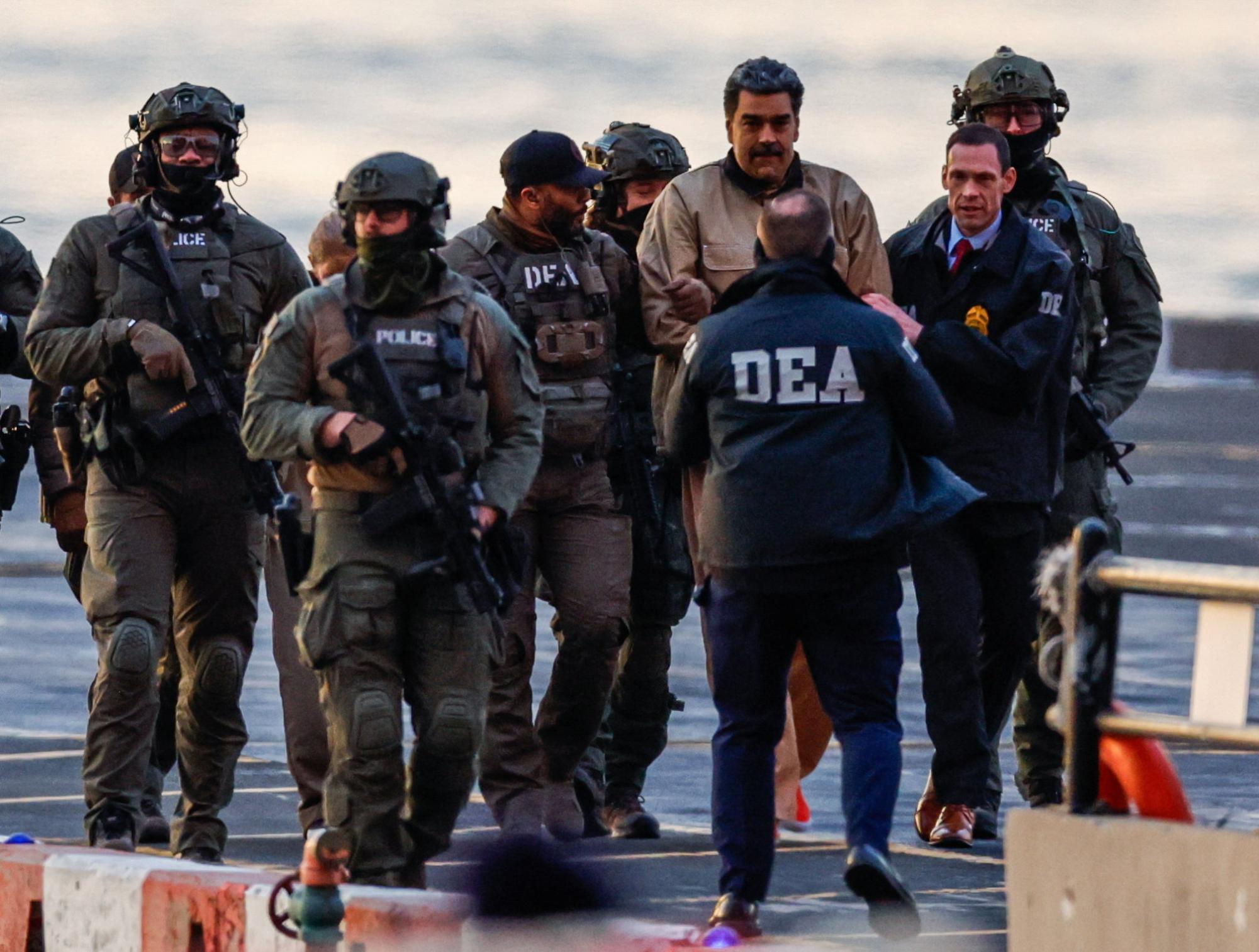 Captured Venezuelan President Nicolas Maduro arrives at the Downtown Manhattan Heliport, as he heads towards the Daniel Patrick Manhattan United States Courthouse for an initial appearance to face U.S. federal charges including narco-terrorism, conspiracy, drug trafficking, money laundering and others in New York City, U.S., January 5, 2026. REUTERS/Eduardo Munoz