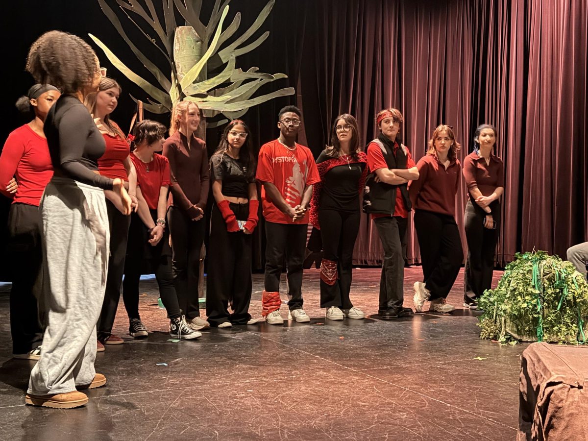 Students answer questions after the preshow for the show, In The Forest of the Night.