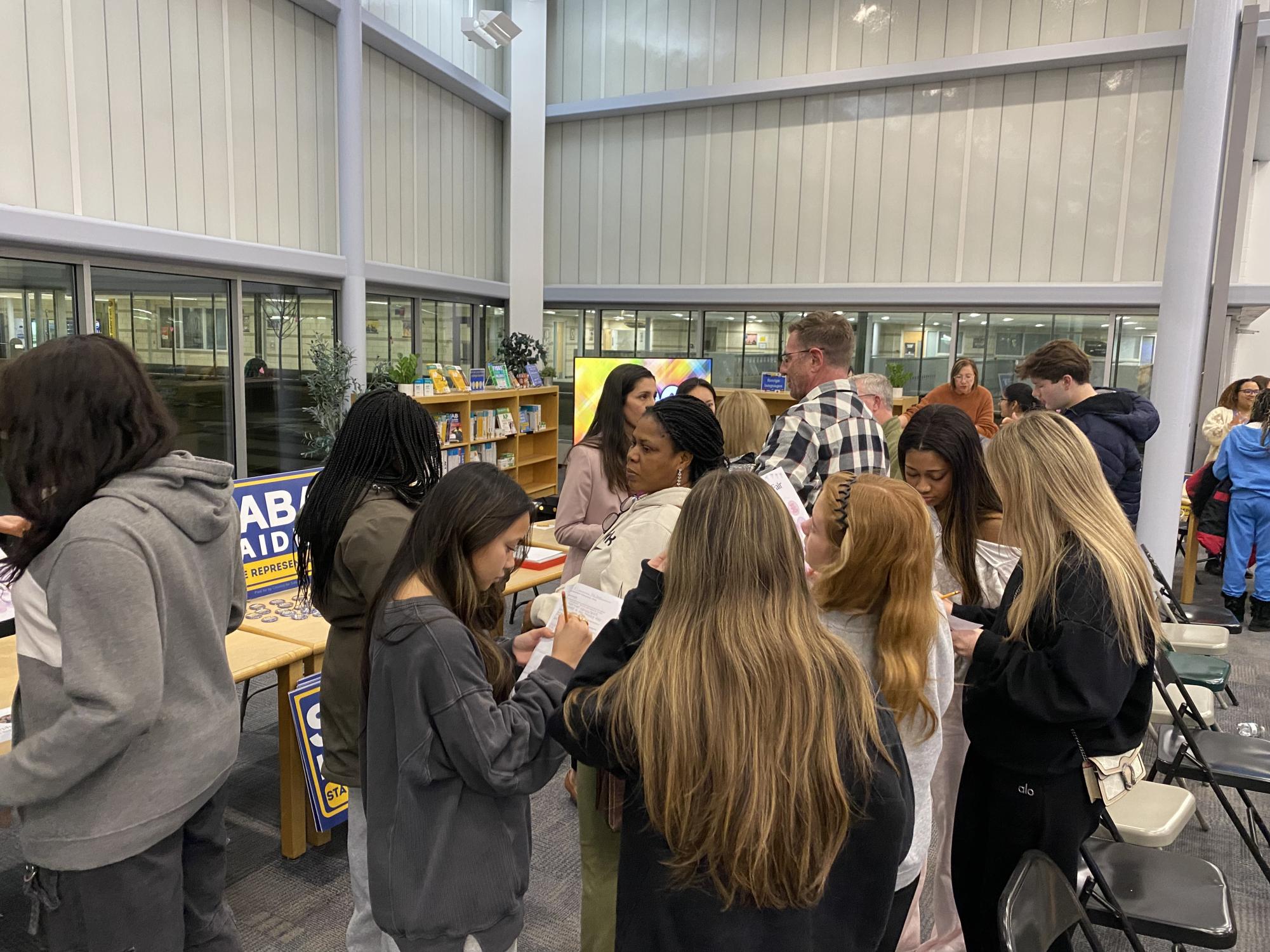 Students filling out their bingo card at the Candidate fair.