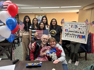 Tech Connect club members "prompose" to 100 year old World War II veteran.