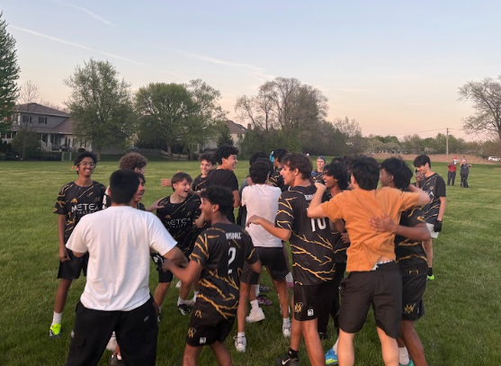 Metea's Ultimate Frisbee players celebrate with the student section after their win against Latin School of Chicago’s Colossus.